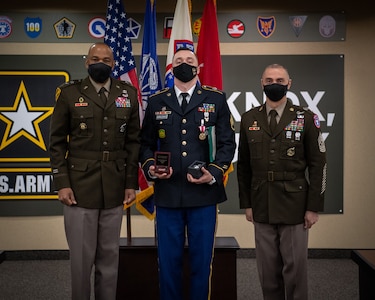 Soldiers stand together during ceremony.