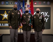 Soldiers stand together during ceremony.