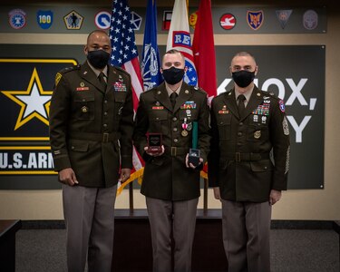 Soldiers stand together during ceremony.