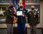 Soldiers stand together during ceremony.