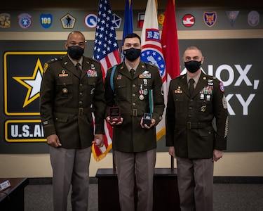 Soldiers stand together during ceremony.