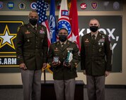 Soldiers stand together during ceremony.