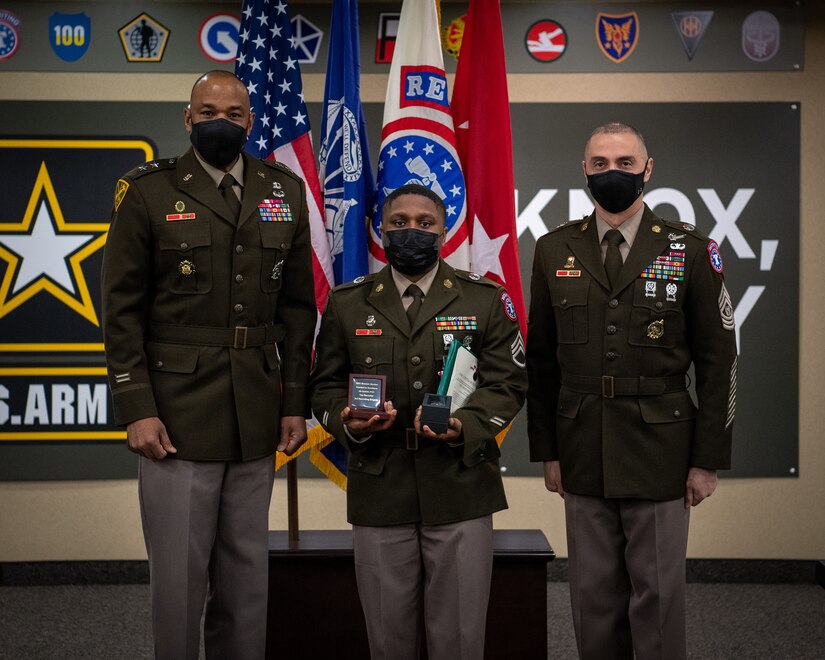 Soldiers stand together during ceremony.