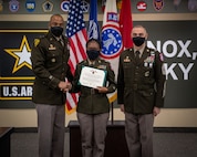 Soldiers stand together during ceremony.