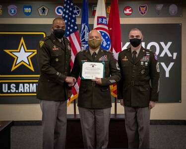 Soldiers stand together during ceremony.