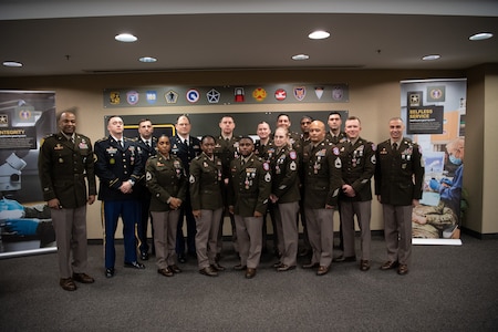 Soldiers stand together during ceremony.