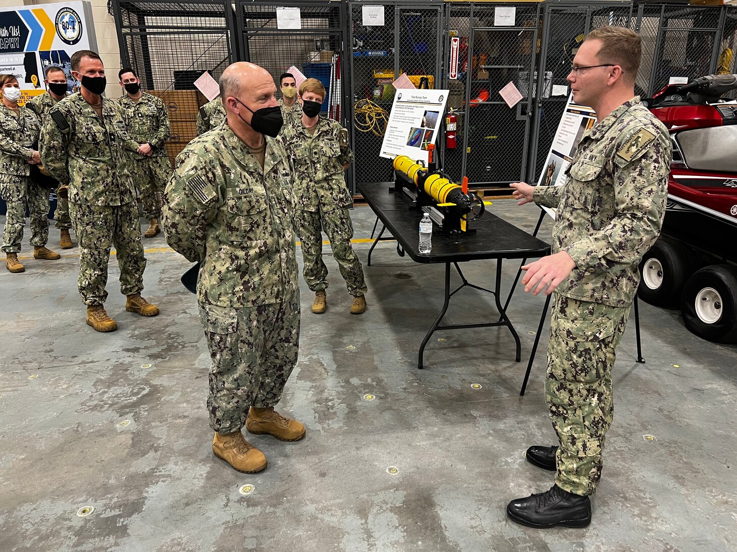 STENNIS, MISS. (Jan. 20, 2022) - Chief of Naval Operations (CNO) Adm. Mike Gilday talks to Aerographer’s Mate 2nd Class Kevin Rolka in the oceanographic high bay of Fleet Survey Team headquarters during his first visit to Naval Oceanography and Meteorology Command (NMOC) at Stennis Space Center, Mississippi, Jan. 20, 2022. The Naval Meteorology and Oceanography Command directs and oversees more than 2,500 globally-distributed military and civilian personnel who collect, process and exploit environmental information to assist Fleet and Joint Commanders in all warfare areas to make better decisions faster than the adversary. (U.S. Navy photo by Lt. Bobby Dixon/released)