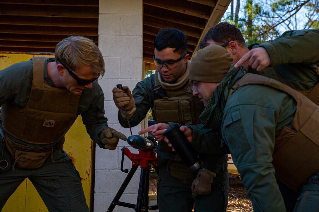 U.S. Marine Corps Staff Sgt. Benjamin McCabe, an Explosive Ordnance Disposal technician with Headquarters and Headquarters Squadron, prepare ordinance materials for disposal at Marine Corps Air Station Cherry Point, North Carolina, Jan. 18, 2022. Training events are intended to familiarize Marines with explosives and how to execute procedures safely.