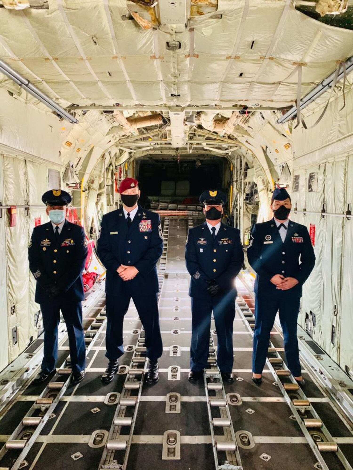 US and Colombian service members pose for a photo in an aircraft