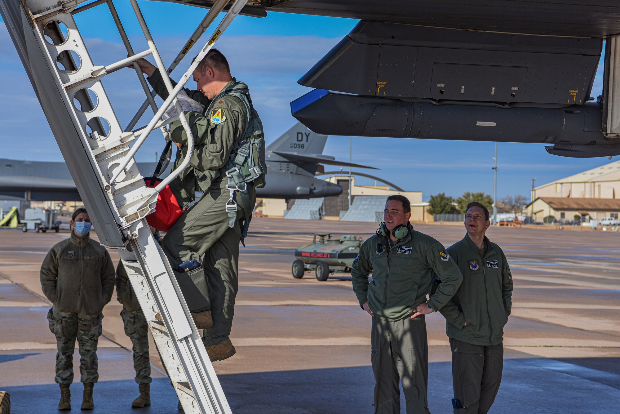 A B-1B Lancer aircrew member departs from the cockpit after Continental United States to Continental United States joint Large Force Exercise alongside fighters from the Japanese Air Self-Defense Force at Dyess Air Force Base, Texas, Jan. 11, 2022. He participated in a 31 hour CONUS to CONUS mission. (U.S. Air Force photo by Airman 1st Class Ryan Hayman)