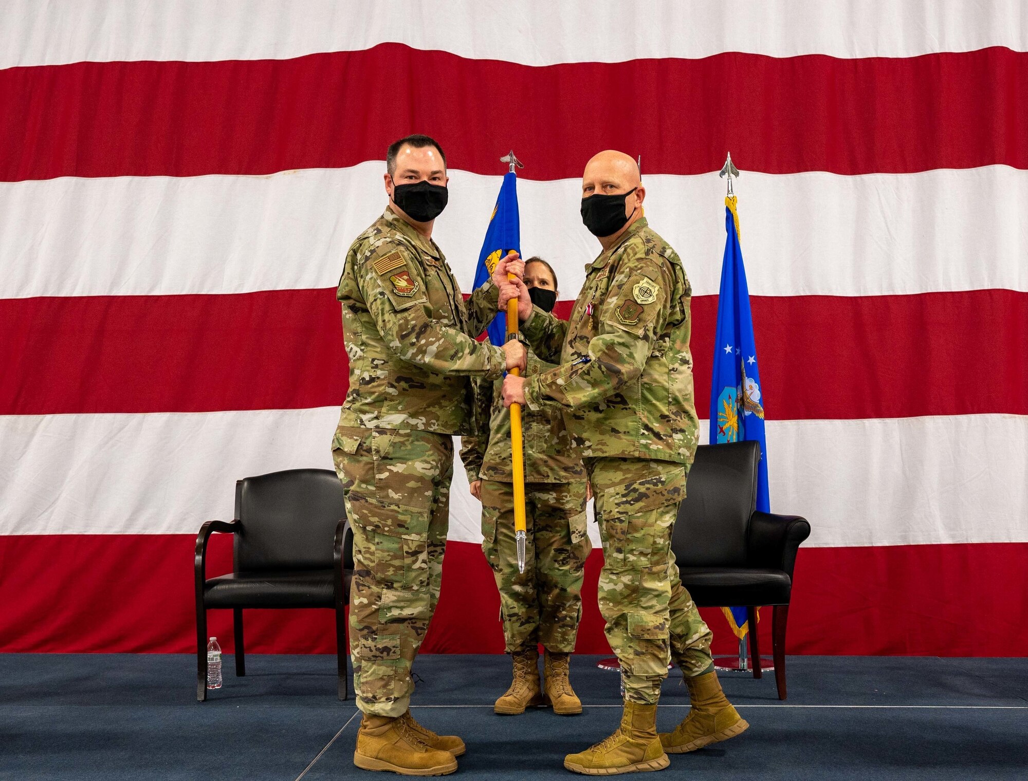 Col. Karwin Weaver, 507th Maintenance Group former commander, relinquishes command of the 507th MXG to Col. Michael Parks, 507th Air Refueling Wing commander, during a ceremony Jan. 8, 2022, at Tinker Air Force Base, Oklahoma. (U.S. Air Force photo by Master Sgt. Grady Epperly)