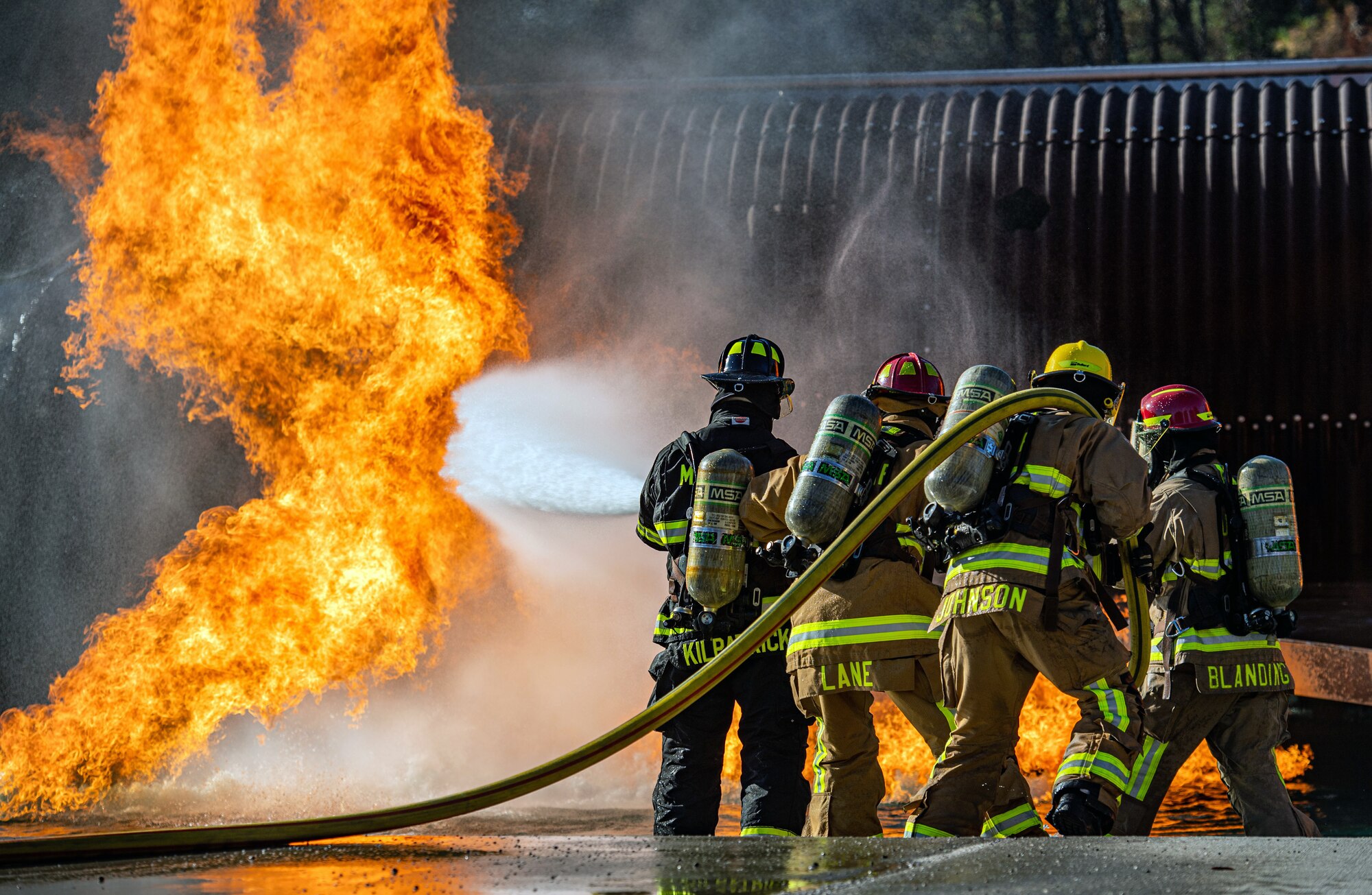 Firefighters assigned to the 628th Civil Engineer Squadron participate in ground fire training