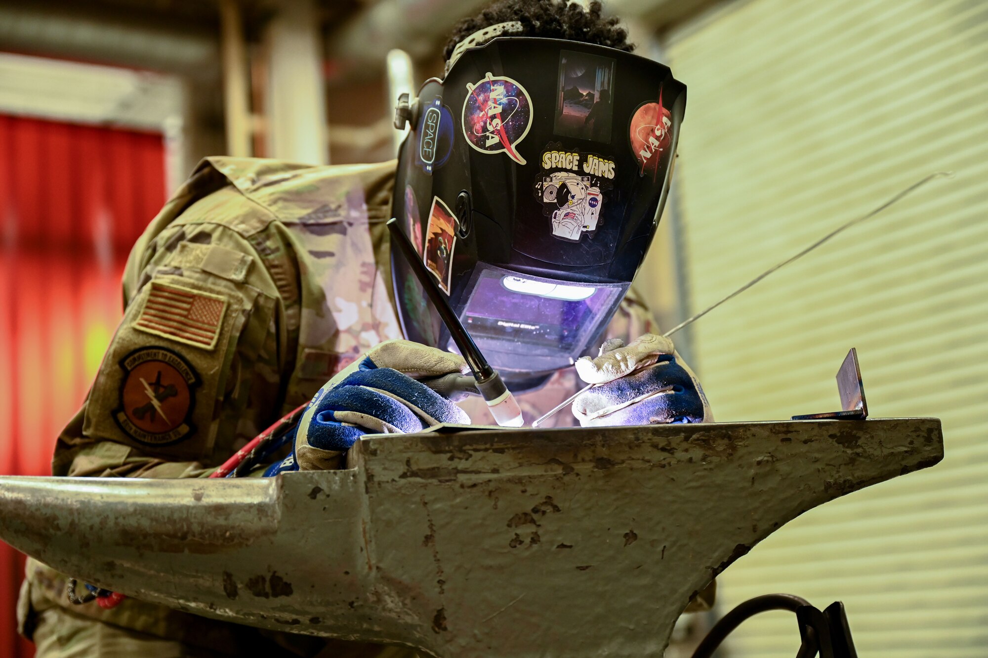 A metals tech welding.