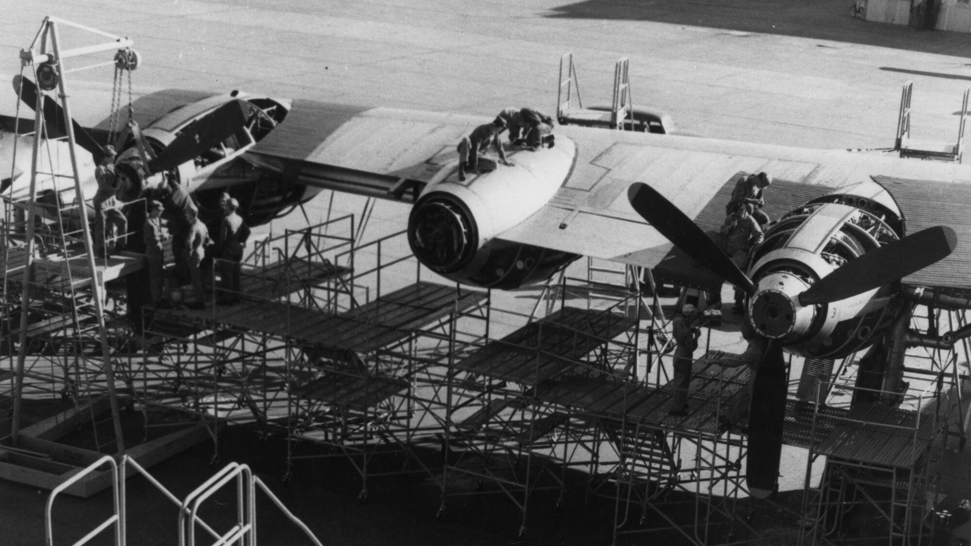 Aircraft maintenance students work on a Convair B-36 Peacemaker in this circa 1950s