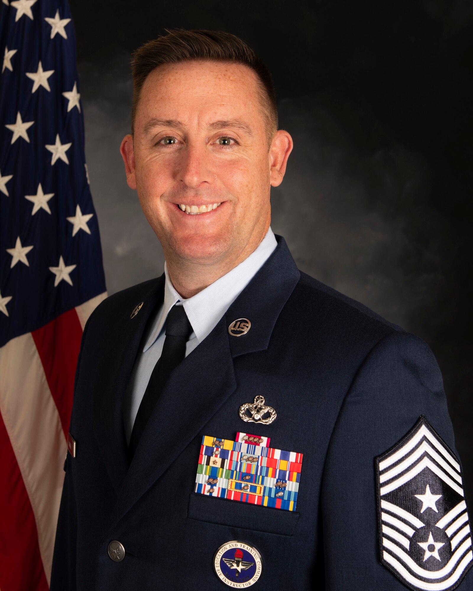 U.S. Air Force Chief Master Sgt. Joshua Trundle, 501st Combat Support Wing command chief, poses for an official photo at Royal Air Force Alconbury, England. (Courtesy photo)