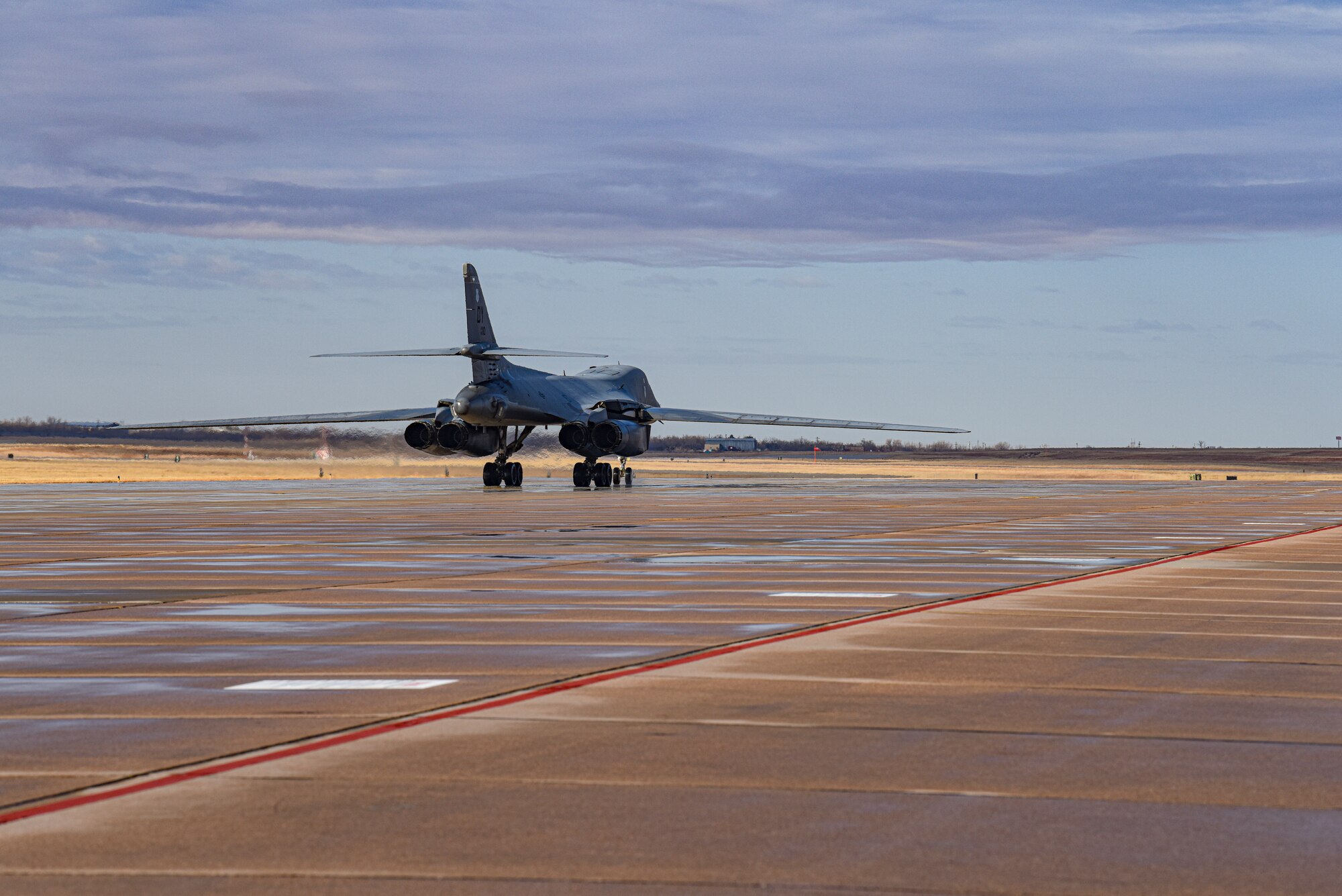 A B-1B Lancer taxis on the flightline after aircrew members completed a Continental United States to Continental United States joint Large Force Exercise alongside the Japanese Air Self-Defense Force at Dyess Air Force Base, Texas, Jan. 11, 2022. The exercise shows our allies and partners are committed to a free and open Indo-Pacific region. (U.S. Air Force photo by Airman 1st Class Ryan Hayman)