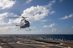 An MQ-8C Fire Scout attached to the “Sea Knights” of Helicopter Sea Combat Squadron (HSC) 22, Detachment 5, takes off from the flight deck of the Freedom-variant littoral combat ship USS Milwaukee (LCS 5), Jan. 6, 2022.