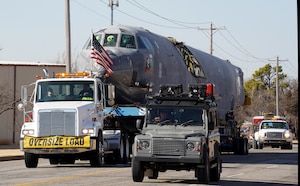 truck carrying airplane on a trailer