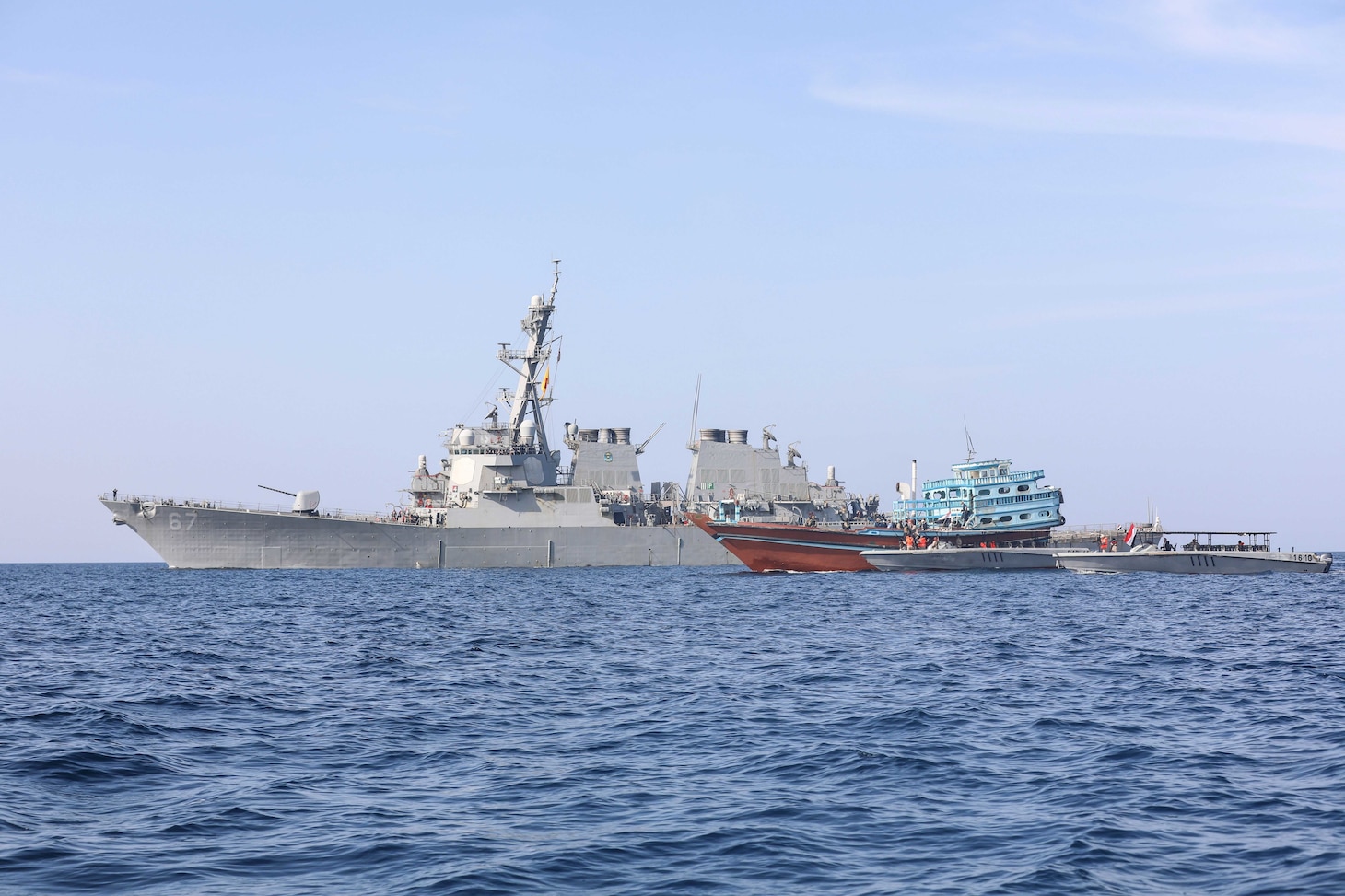 USS Cole (DDG 67) transfers control of a stateless fishing vessel to the Yemen Coast Guard in the Gulf of Oman.