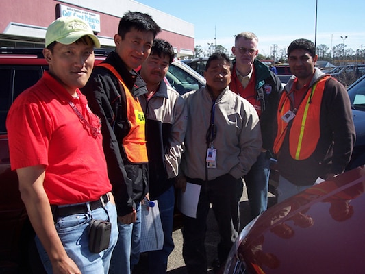 Ku Pon-chun (far left), U.S. Army Corps of Engineers (USACE) Far East District (FED) civil engineer, poses with other volunteers deployed during Federal Emergency Management Agency (FEMA) recovery efforts for Hurricane Katrina in Mississippi, February 2006. (Courtesy photo by Ku Pon-chun)