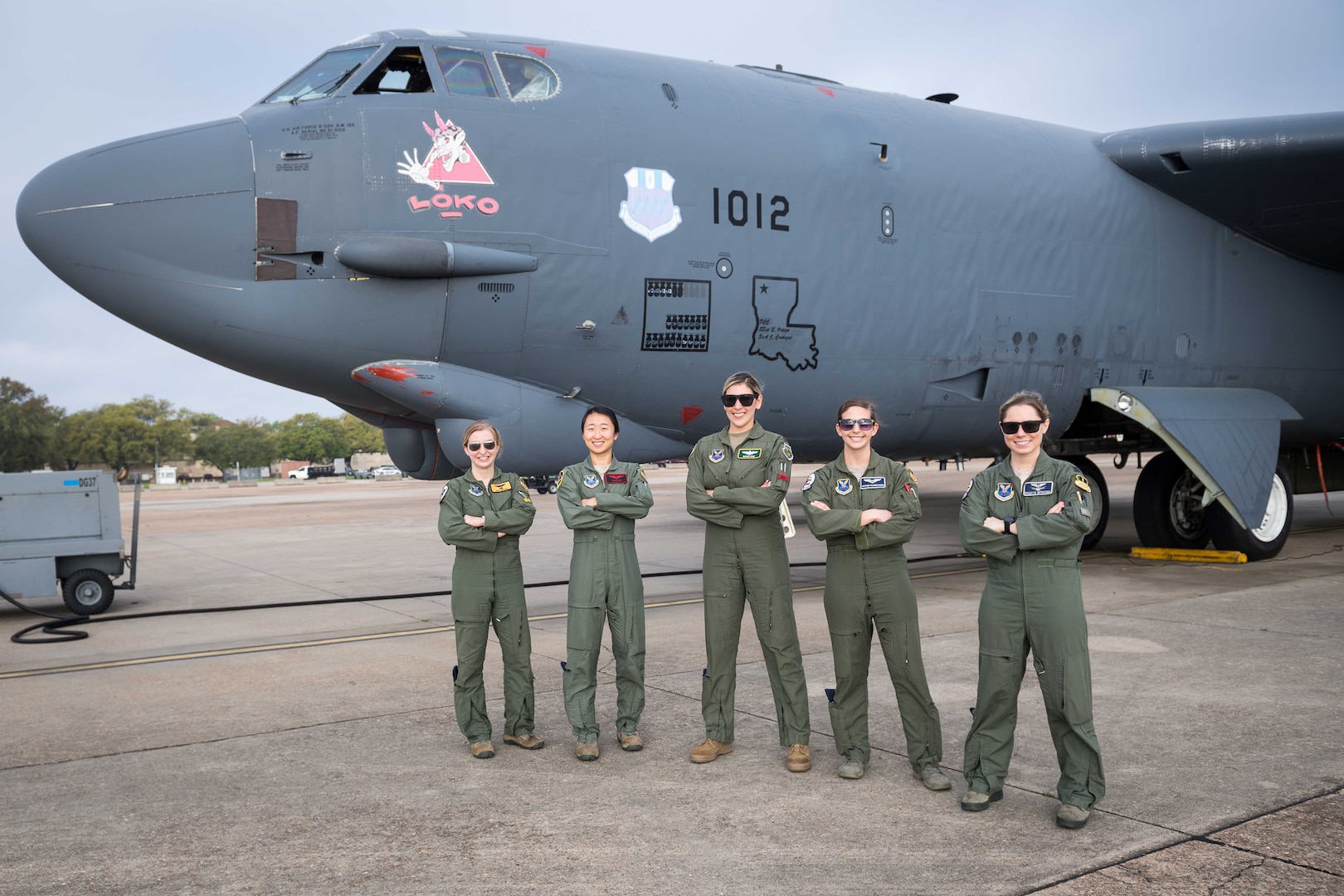 Women stand before a B-52.