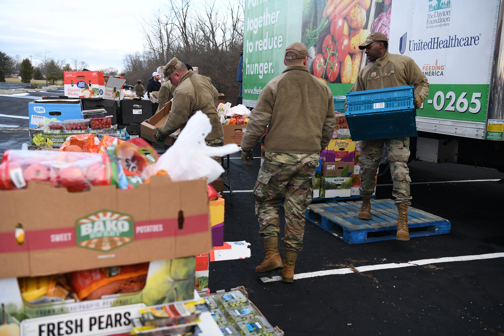 Fifteen Reserve Citizen Airmen from the 445th Airlift Wing and 655th Intelligence, Surveillance and Reconnaissance Wing, Wright-Patterson Air Force Base, Ohio, volunteered at a mobile food bank delivery held at Phillips Temple Church, Trotwood, Ohio Jan. 19, 2022. Volunteers collected, sorted, organized and prepped food that included fresh fruit, vegetables, chicken and baked goods that was given to families in need within the Trotwood area. The Airmen helped serve 86 families for a total of 145 individuals.