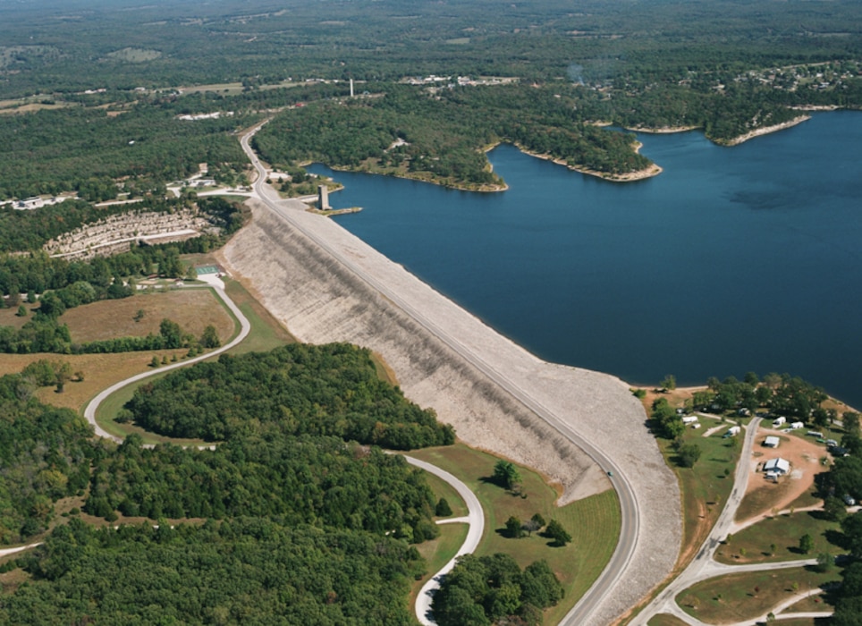 Overhead view of the Pomme de Terre Dam. Pomme de Terre Lake is located in the rugged, tree covered hills of the west central Missouri Ozarks on the Pomme de Terre River. The Pomme de Terre Project was authorized by Congress in 1938 as part of a comprehensive flood control plan for the Missouri River Basin. Project Planning was initiated in 1947 and actual construction began in 1957. The lake was completed in 1961 at a cost of $14,946,784.