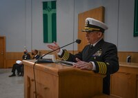 Capt. Kenneth S. Pickard delivers his first speech as Commodore, Commander, Task Force 63, during a change of command ceremony held at Naval Support Activity Naples, Italy, Jan. 21, 2022. U.S. Naval Forces Europe and Africa, headquartered in Naples, Italy, conducts the full spectrum of joint and naval operations, often in concert with allied and interagency partners, in order to advance U.S. national interests, security and stability in Europe and Africa.