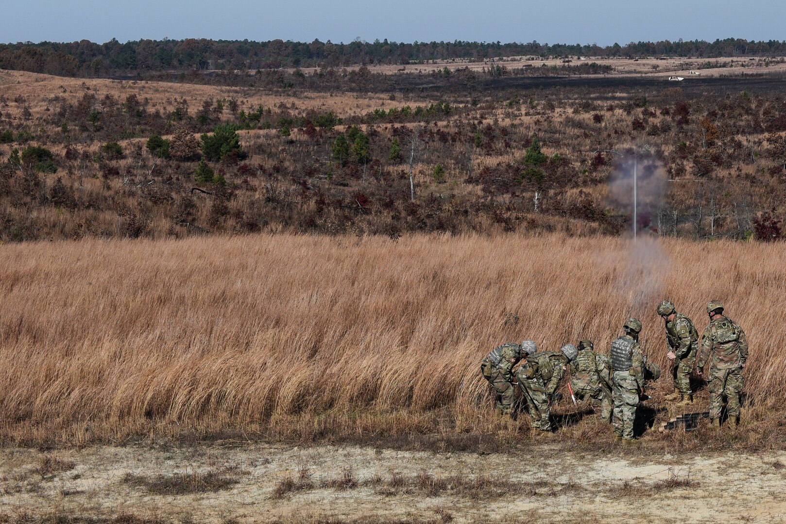 U.S. National Guard Soldiers conduct a mortar live fire as part of the 11C Indirect Fire Infantryman Course taught by cadre assigned to 1st Battalion, 183rd Regiment, Regional Training Institute Nov. 18, 2021, at Fort A.P. Hill, Virginia. The live fire was the culminating event for the six students in the course, who will earn the 11C  military occupational speciality after successful completion of the course. (U.S. Army National Guard photo by Sgt. 1st Class Terra C. Gatti)