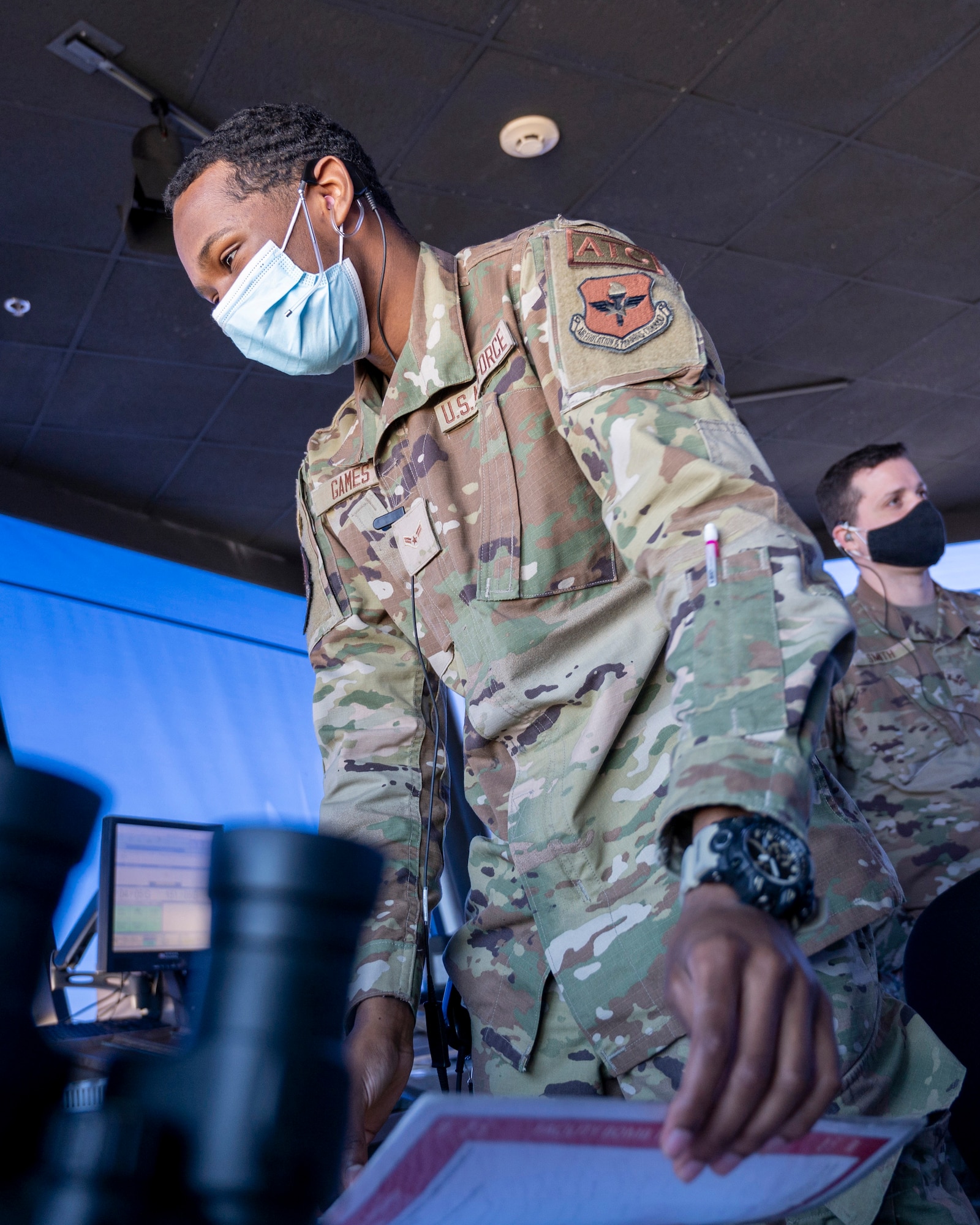 Airman First Class Pierce Games from the 47th Operations Support Squadron converse with pilots in the air in the Air Traffic Control Tower on January 18, 2022 at Laughlin Air Force Base, Texas. Air Traffic Controllers play a critical part in the mission of getting pilots airborne and keeping them safe in the skies. (U.S. Air Force photo by Senior Airman Nicholas Larsen)