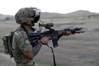A Ranger from 3rd Battalion, 75th Ranger Regiment executes a live fire exercise with the IVAS Capability Set 4 during tropical weather testing in Camp Santiago, Puerto Rico, in March 2021.