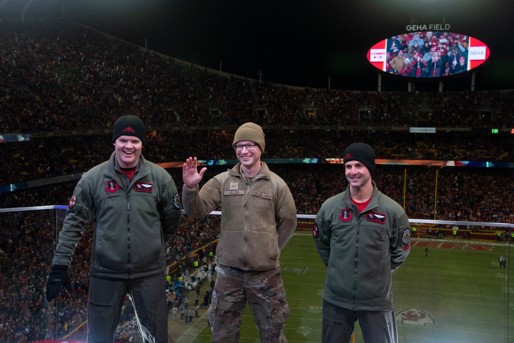 Members of the ground crew, from left to right, Lt. Col. Ponzi Meyer, Staff Sgt. Anthony Allen and Maj. Spider Falcone wave to the crowd following a B-2 Spirit flyover during the AFC Divisional Playoff game at Arrowhead Stadium, Kansas City, Missouri, Jan. 23, 2022. Meyer and Falcone are B-2 Spirit pilots with the 131st Bomb Wing, Missouri National Guard, and Allen is a B-2 crew chief with the 509th Aircraft Maintenance Squadron, Whteiman Air Force Base. B-2 crews perform flyovers as part of regularly scheduled training flights and to support community functions and government events. (U.S. Air National Guard photo by Airman 1st Class Kelly C. Ferguson)