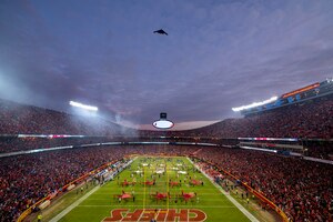 A B-2 Spirit from Whiteman Air Force Base, Missouri, performs a flyover before the AFC Divisional Playoff game at Arrowhead Stadium, Kansas City, Missouri, Jan. 23, 2022. B-2 crews perform flyovers as part of regularly scheduled training flights and to support community functions and government events. (U.S. Air Force Photo by Tech. Sgt. Dylan Nuckolls)