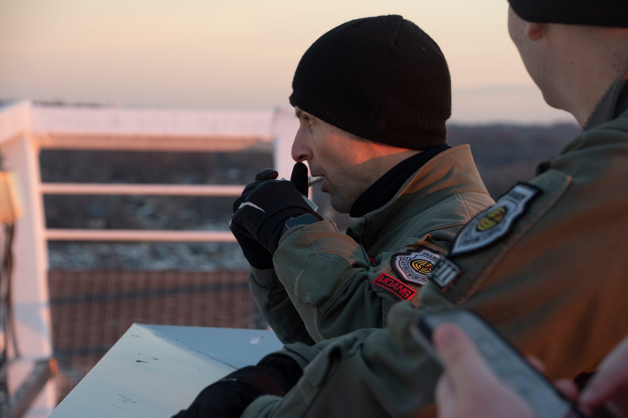Maj. Spider Falcone, a B-2 Spirit pilot assigned to the 131st Bomb Wing of the Missouri Air National Guard out of Whiteman Air Force Base, Missouri, communicates with B-2 Spirit pilots scheduled for a flyover during an AFC  Divisional Playoff game at Arrowhead Stadium in Kansas City, Missouri, Jan. 23, 2022. B-2 crews perform flyovers as part of regularly scheduled training flights and to support community functions and government events. (U.S. Air National Guard photo by Airman 1st Class Kelly C. Ferguson