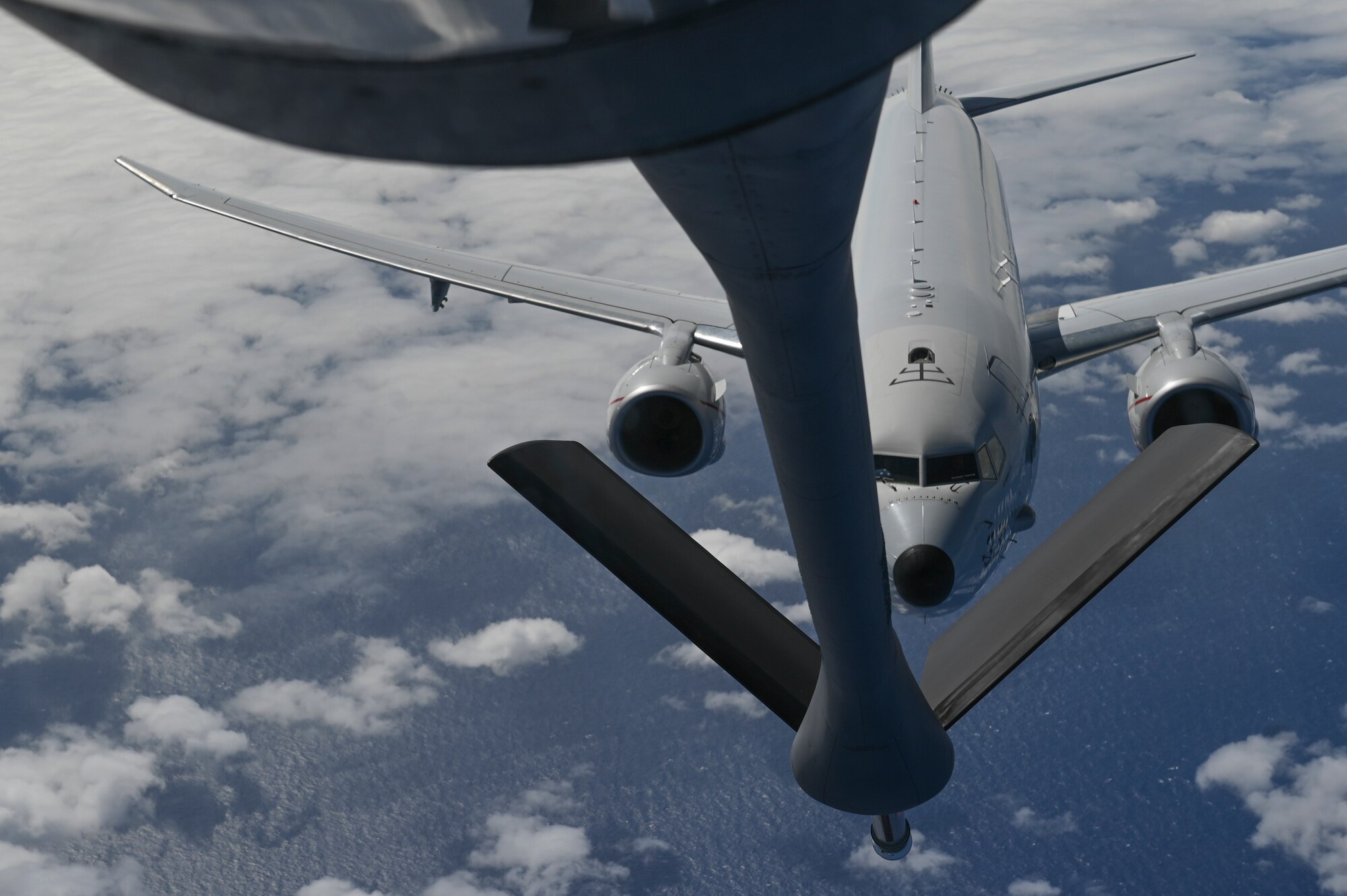 A plane prepares to get refueled.