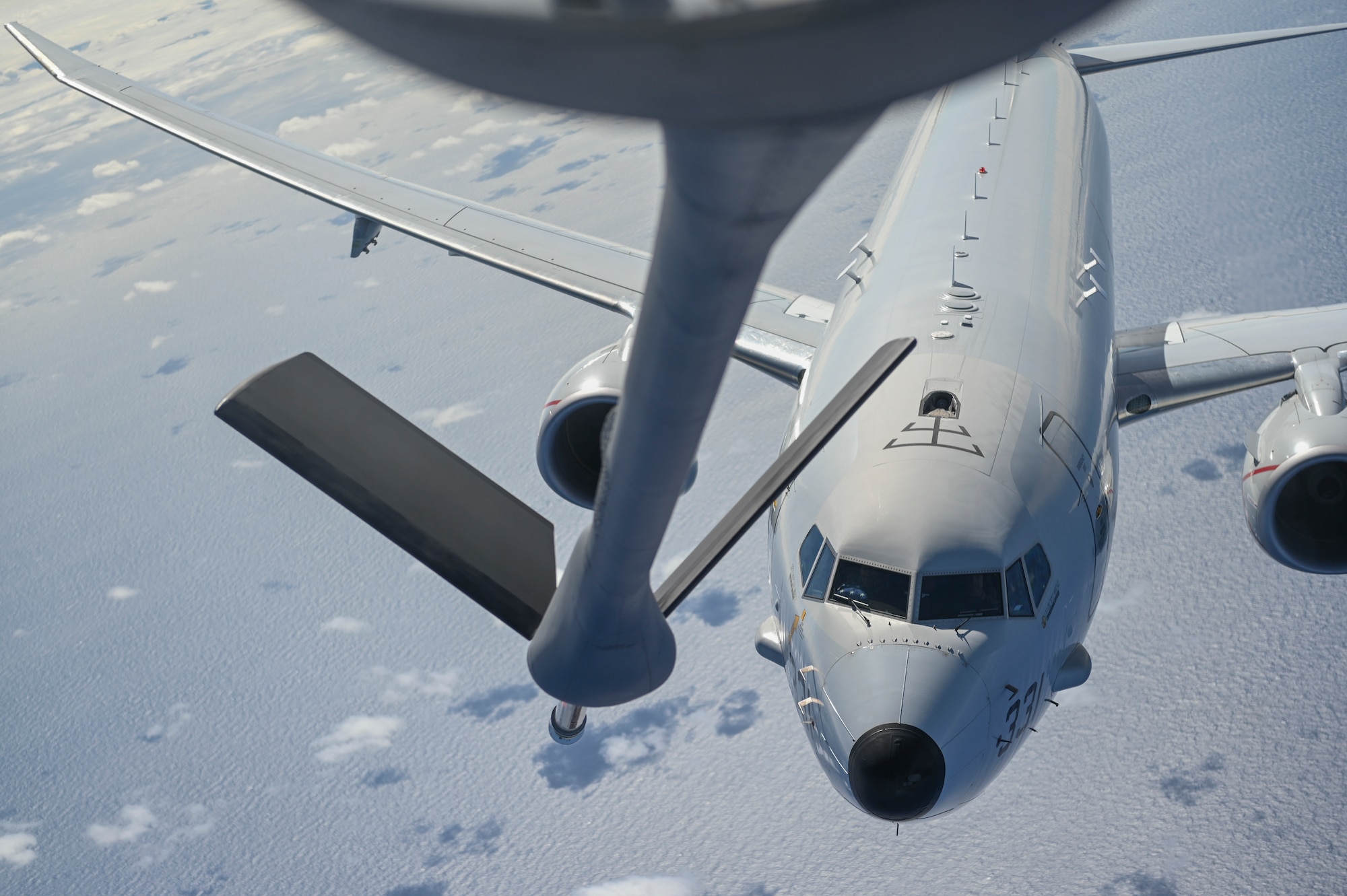 A plane prepares to get refueled.