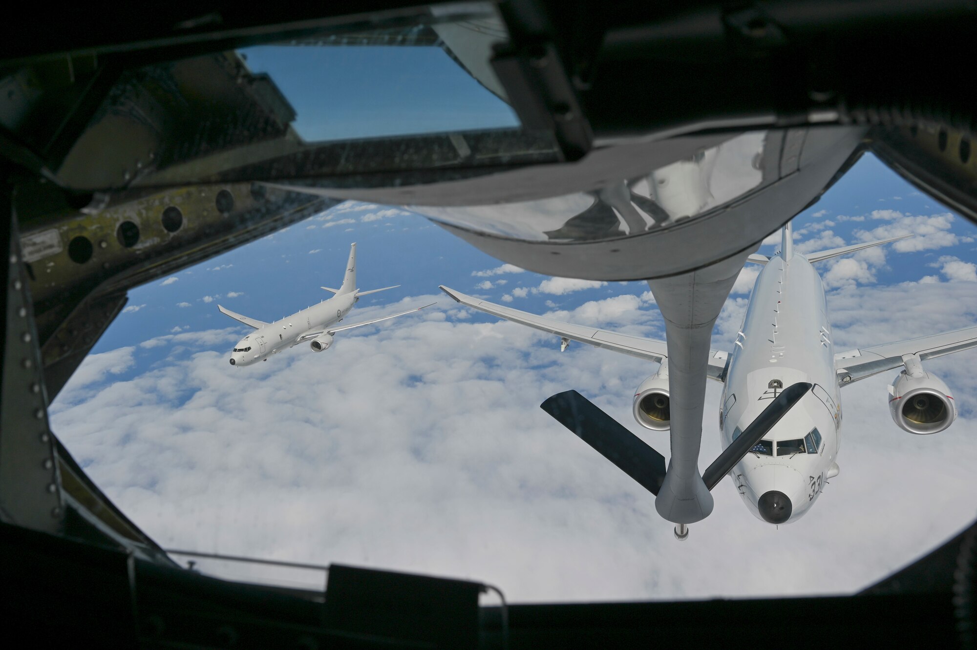 Two planes prepare to get refueled.