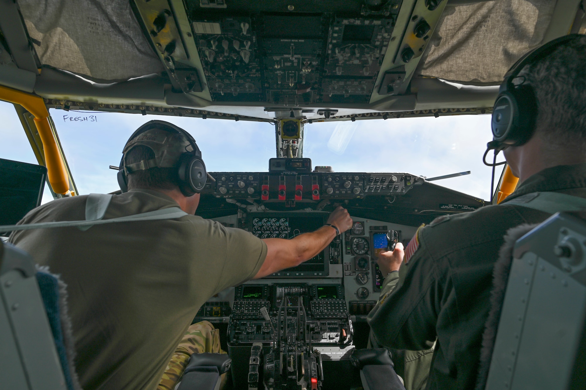 Two pilots flying a plane.