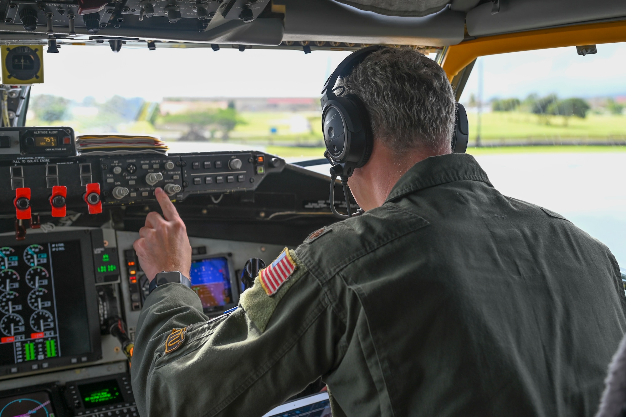 A pilot pushes a button.