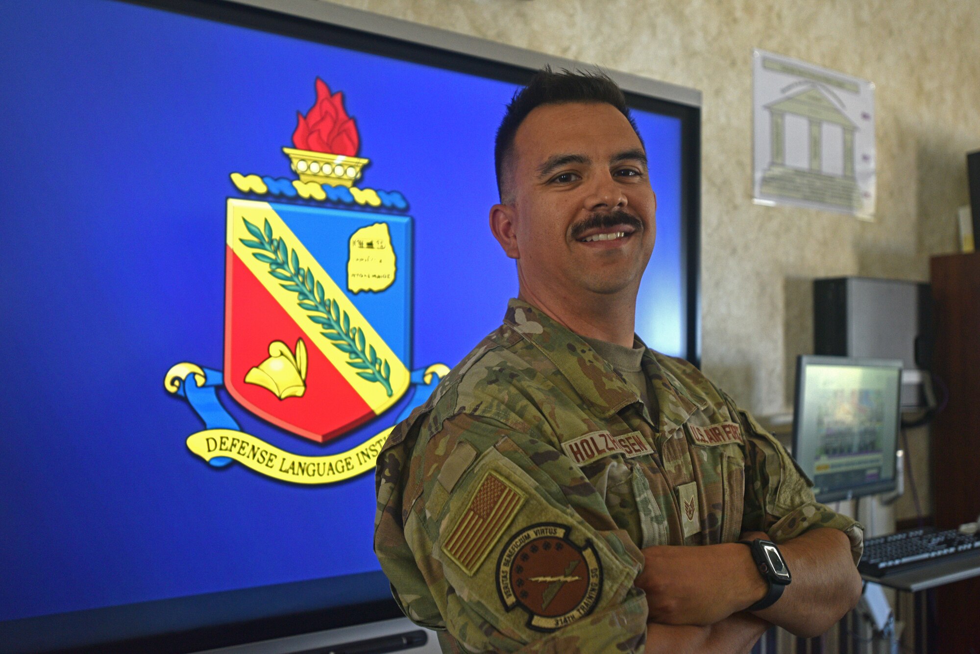 U.S. Air Force Staff Sgt. Uruwishi Holzhausen, 314th Training Squadron military language instructor, poses for a photo on the Presidio of Monterey, California, July 21, 2021. Holzhausen went through the Chinese mandarin course at the Defense Language Institute Foreign Language Center in 2010. (U.S. Air Force photo by Senior Airman Ashley Thrash)