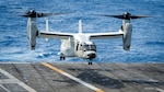 PHILIPPINE SEA (Jan. 21, 2022) A CMV-22B Osprey, assigned to the “Titans” of Fleet Logistics Multi-Mission Squadron (VRM) 30, prepares for landing on the flight deck of the Nimitz-class aircraft carrier USS Carl Vinson (CVN 70), Jan. 21, 2022. Operating as part of U.S. Pacific Fleet, USS Carl Vinson is conducting training to preserve and protect a free and open Indo-Pacific region. (U.S. Navy photo by Mass Communication Specialist Seaman Leon Vonguyen)