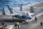 PHILIPPINE SEA (Jan. 22, 2022) ) Sailors taxi an F-35C Lightning II, assigned to the “Argonauts” of Strike Fighter Squadron (VFA) 147, on the flight deck of Nimitz-class aircraft carrier USS Carl Vinson (CVN 70), Jan. 22, 2022. Operating as part of U.S. Pacific Fleet, Vinson is conducting training to preserve and protect a free and open Indo-Pacific region. (U.S. Navy photo by Mass Communication Specialist Seaman Leon Vonguyen)
