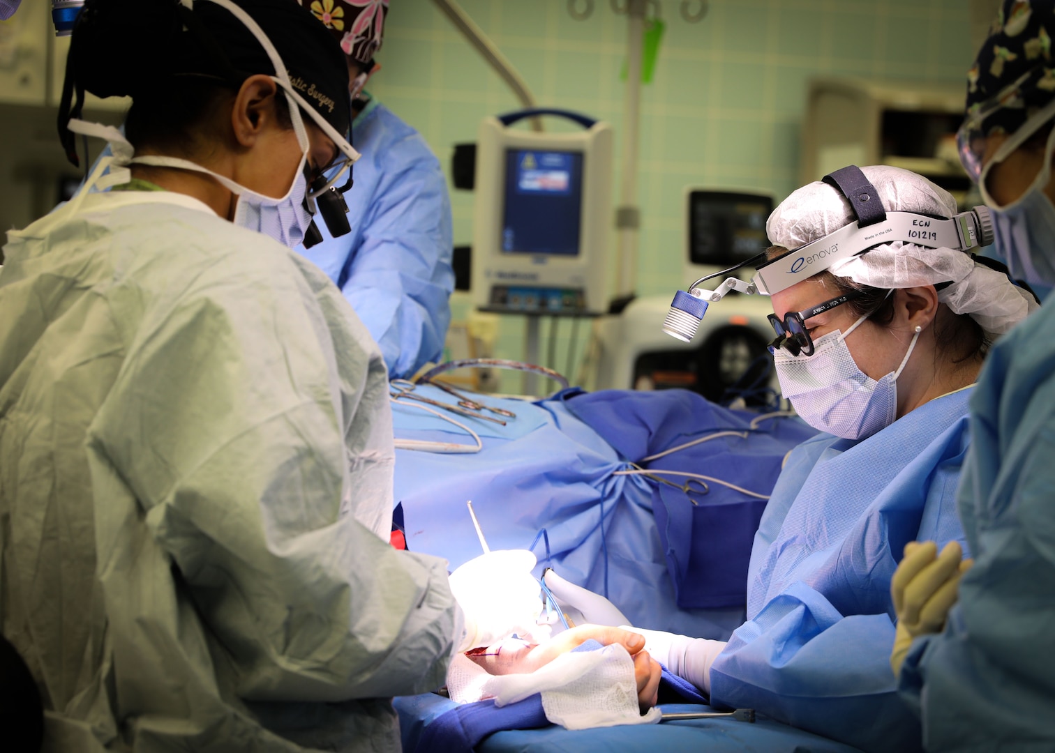 (From left) U.S. Army Lt. Col. Shimul Patel, chief, Plastic Surgery Services, Landstuhl Regional Medical Center, and U.S. Army Lt. Col. Jessica Peck, chief, Ear, Nose and Throat Clinic, LRMC, operate on a cancer patient during the first microvascular reconstruction and anastomosis procedure ever performed at LRMC, Dec. 3. The first-of-its-kind procedure at LRMC expands services and capabilities at the only Level II Trauma Center outside the United States and principal evacuation and treatment center for all injured U.S. Service Members, civilians and Coalition Forces serving across Europe, Africa and the Middle East.