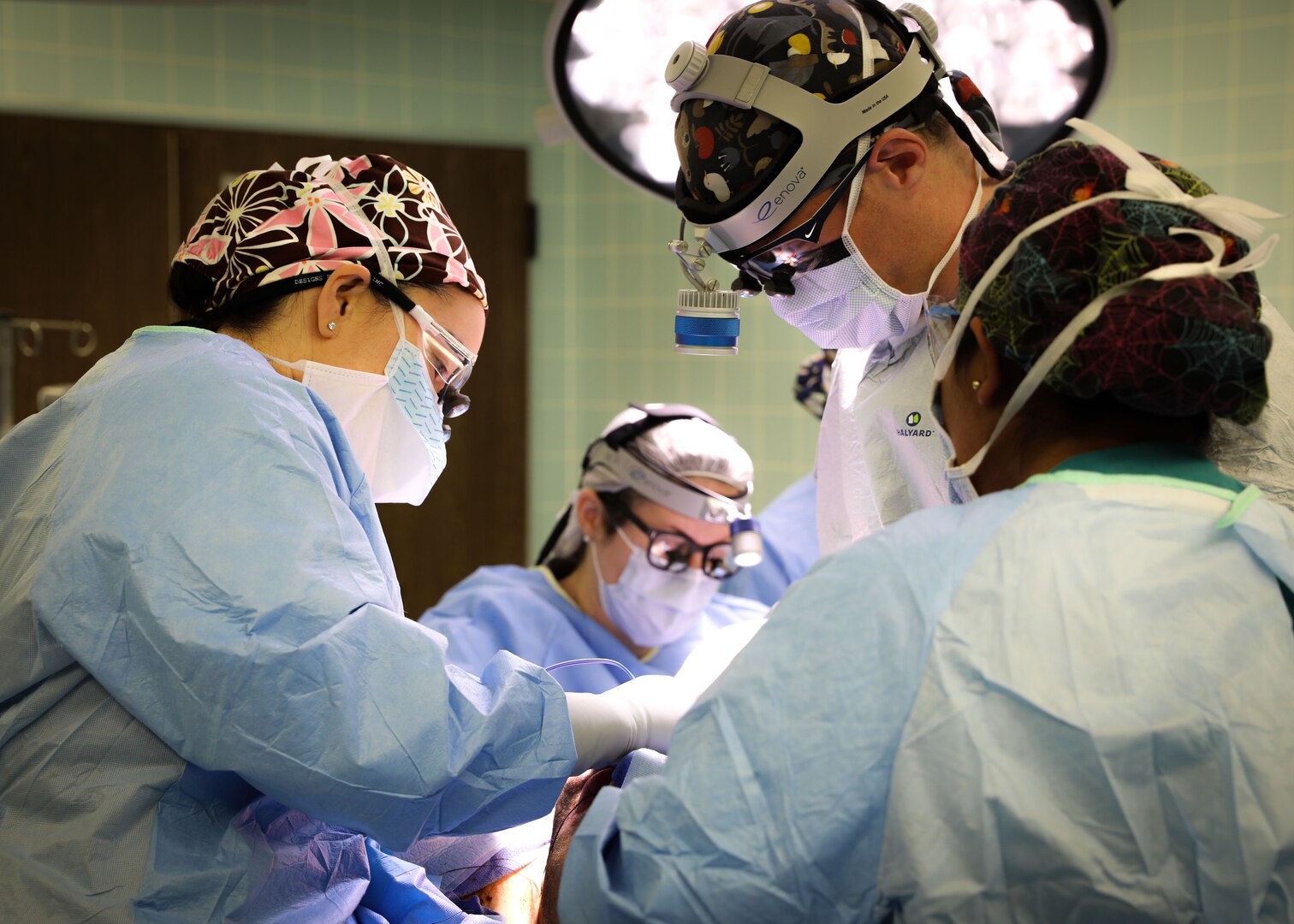 (From left) U.S. Army Lt. Col. Shimul Patel, chief, Plastic Surgery Services, Landstuhl Regional Medical Center, and U.S. Army Lt. Col. Jessica Peck, chief, Ear, Nose and Throat Clinic, LRMC, operate on a cancer patient during the first microvascular reconstruction and anastomosis procedure ever performed at LRMC, Dec. 3. The first-of-its-kind procedure at LRMC expands services and capabilities at the only Level II Trauma Center outside the United States and principal evacuation and treatment center for all injured U.S. Service Members, civilians and Coalition Forces serving across Europe, Africa and the Middle East.