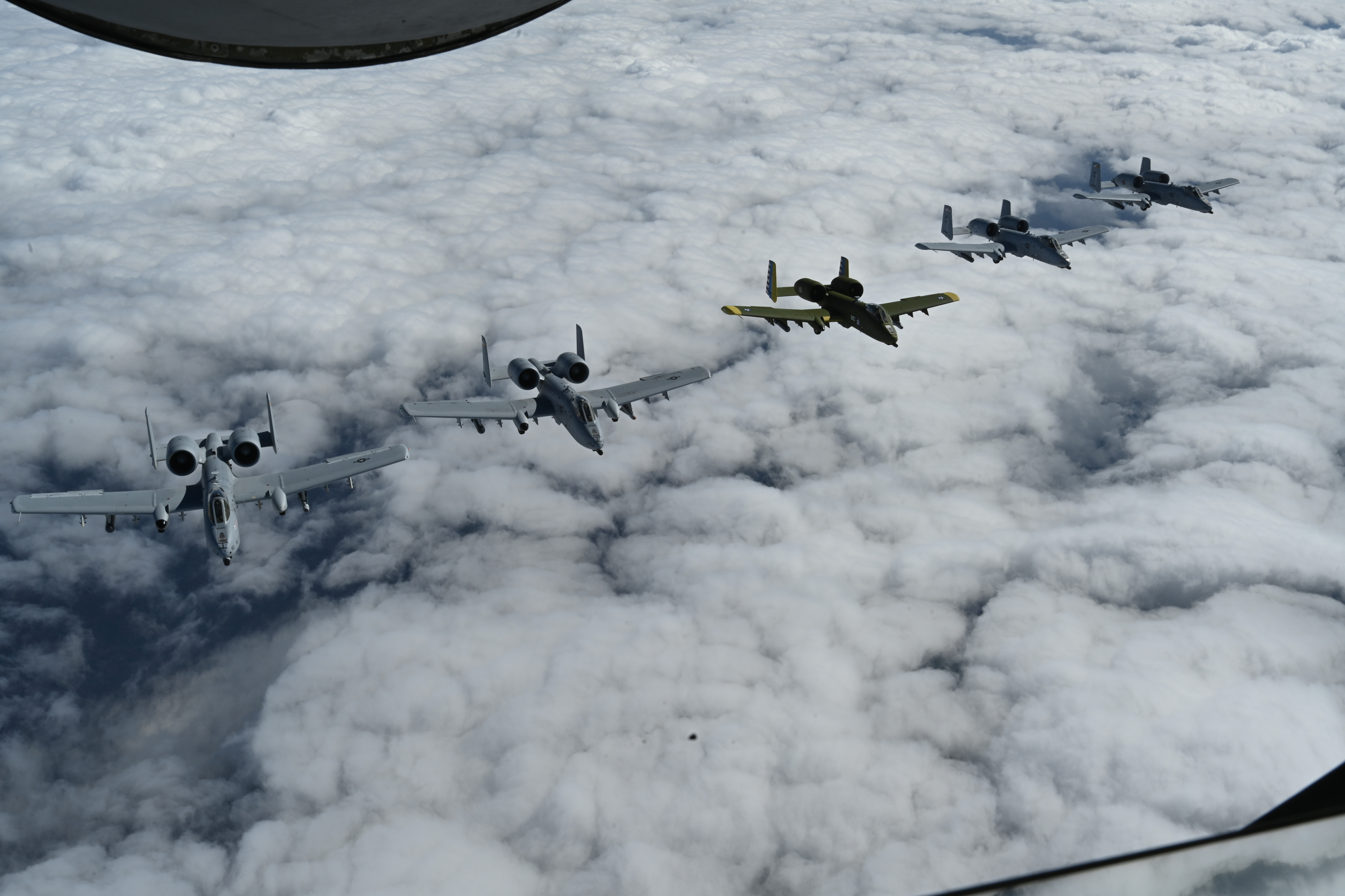 A-10’s from the 175th Wing fall into a formation after refueling from a KC-135 Stratotanker from the 914th Air Refueling Wing, over northern Maryland, Oct. 13, 2021.  Spouses of the A-10c Thunderbolt II aircraft pilots were given the opportunity to watch the process of refueling in flight. (U.S. Air National Guard photo by Airman Alexandra Huettner)