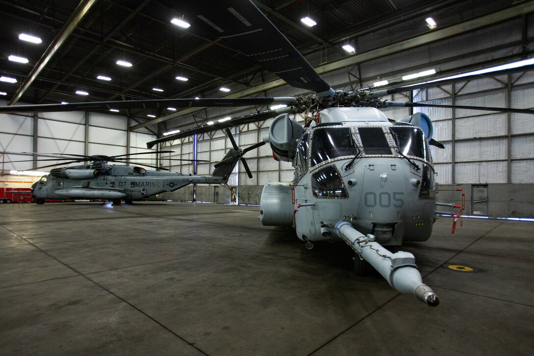A CH-53K King Stallion (right) and a CH-53E Super Stallion are staged during a redesignation ceremony at Marine Corps Air Station New River, North Carolina, Jan. 24, 2022. The squadron received its first CH-53K King Stallion, and the ceremony signified the beginning of the Marine Corps’ modernization from the CH-53E Super Stallion to the CH-53K King Stallion in support of the expeditionary warfare vision for future-force employment. The CH-53K is an optimized vertical, heavy-lift, sea-based, long-range solution for the Marine Corps and will provide three times the lift capability of its predecessor.  (U.S. Marine Corps photo by Lance Cpl. Elias E. Pimentel III)