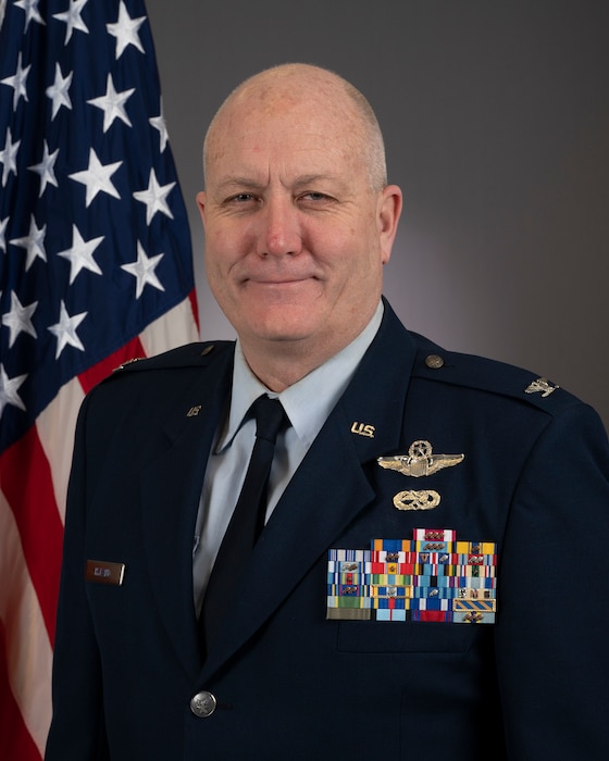 Airman poses for official photo