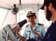 Lt. (j.g.) Beverly Kelley, first woman to command a U.S. military vessel, on the bridge of the 95-foot cutter Cape Newagen. (U.S. Coast Guard photo)