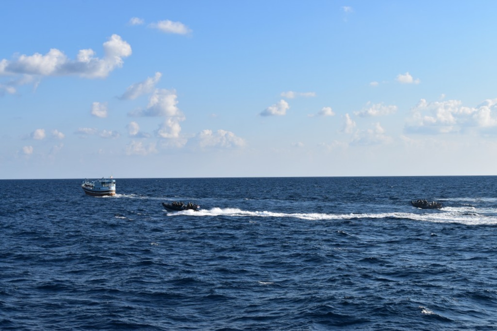 GULF OF OMAN (Jan. 15, 2022) Personnel from Royal Navy frigate HMS Montrose (F236) aboard small boats interdict a stateless dhow while transiting international waters in the Gulf of Oman, Jan. 15. (U.S. Navy photo)