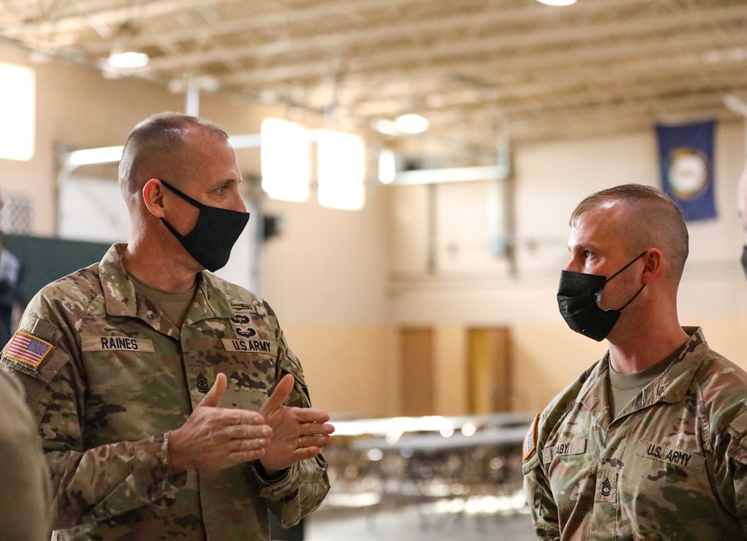 Kentucky National Guard leadership welcomed National Guard Bureau’s senior leaders on Jan. 23-24, to recognize Guard members for their efforts and thank them for supporting local communities in western Kentucky. National Guard Bureau Command Sgt. Maj. John T. Raines III converses with Sgt. 1st Class Matthew Raby at the 438th Military Police Company armory in Murray, Ky., Jan. 22, 2022.